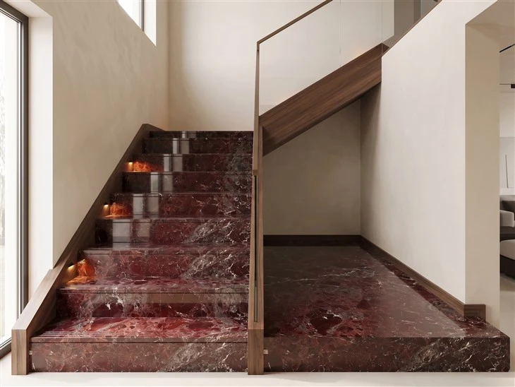 Polished Rosso Levanto marble interior staircase with matching risers, walnut side panels and a glass railing